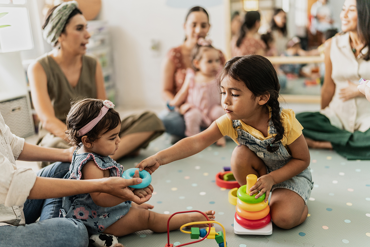 Girls playing together in the playroom.