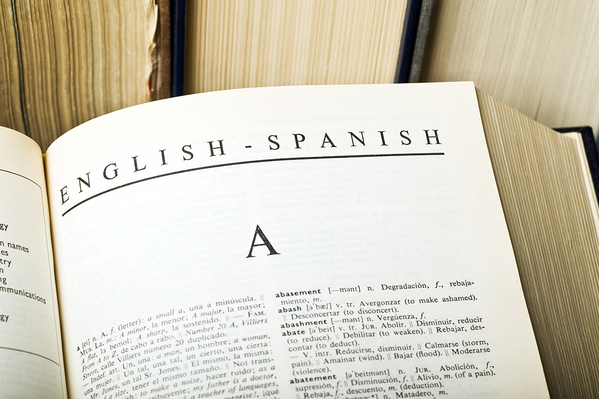 language learning. Photograph of an English-Spanish dictionary. 