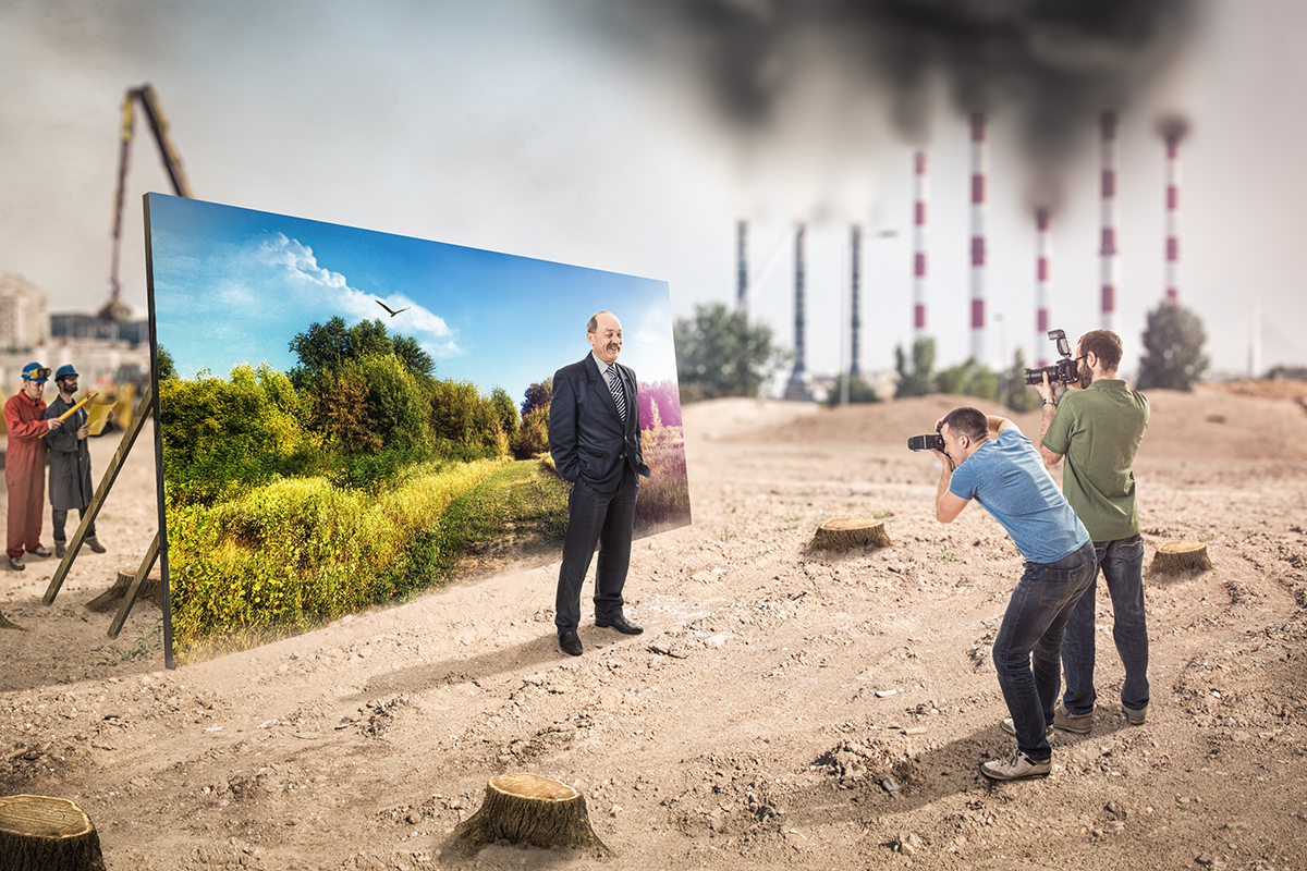 Representation of social washing, where a businessman is photographed in front of a forest banner. In the background the world is gray, treeless, polluted. 