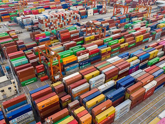 Trump tariffs - image of a port full of containers.